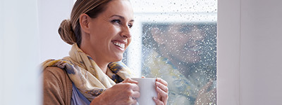 Woman looking out window