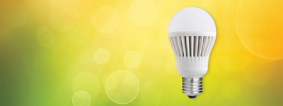 led bulb on green background